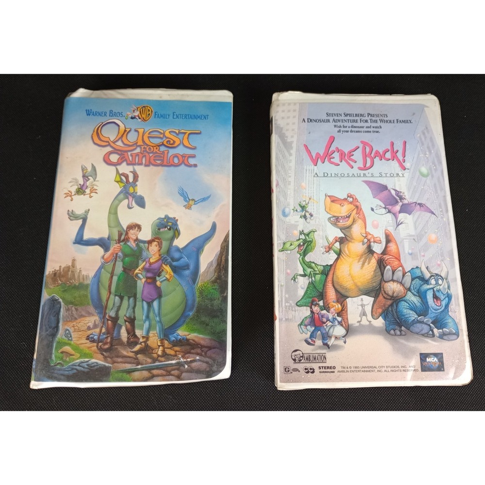 Lot of 2 VHS Clamshell Video Tapes WB Quest for Camelot MCA We're Back Dinosaur